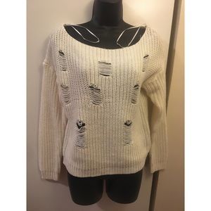 Distressed white sweater